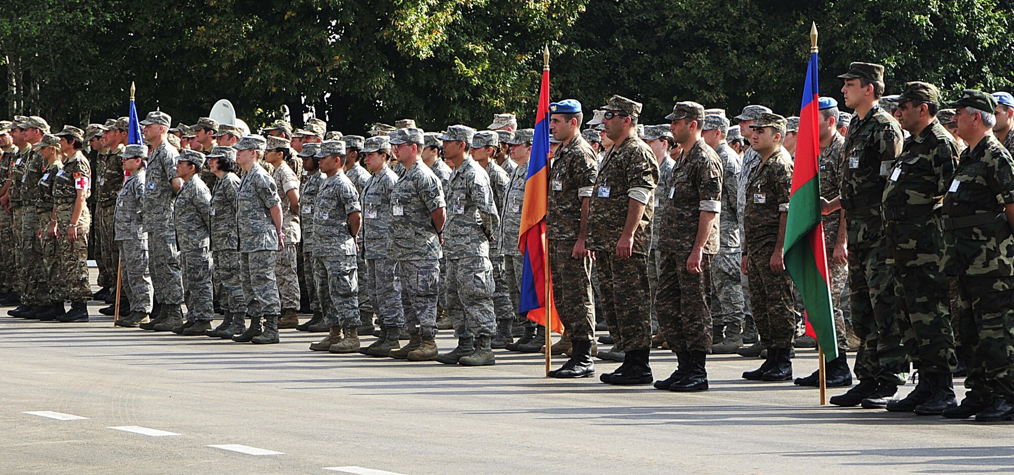 (left to right) Representatives of the armed forces of Montenegro, the United States, Armenia and Azerbaijan stand together in formation during the opening ceremony for MEDCEUR 2010, a medical training exercise in central and eastern Europe, on Danilovgrad Army Base, Montenegro, Sept. 10. Servicemembers from ten nations participated in the formation and will work together during the exercise to grow more efficient in emergency response towards the end of saving lives. For more information, visit www.usafe.af.mil/medceur.asp and www.odbrana.gov.me. (U.S. Air Force photo/Airman 1st Class Tiffany Deuel)