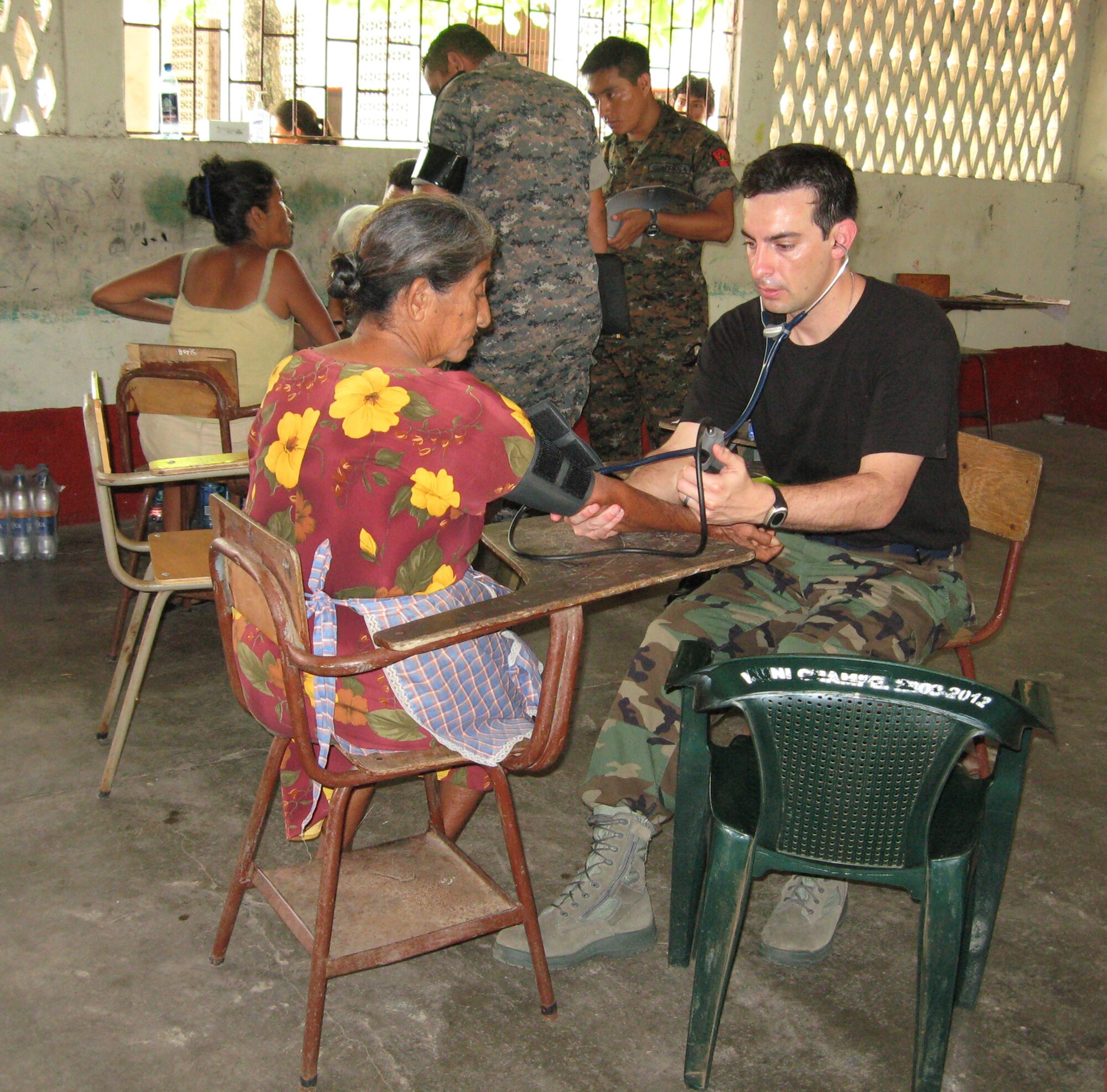 WRIGHT-PATTERSON AIR FORCE BASE, Ohio - Tech. Sgt. Craig Stevenson, 445th Aeromedical Staging Squadron, checks the blood pressure of a local resident in Champerico, Guatemala, as part of the 2010 Guatemala Medical Readiness Training Exercise. (Courtesy photo) 