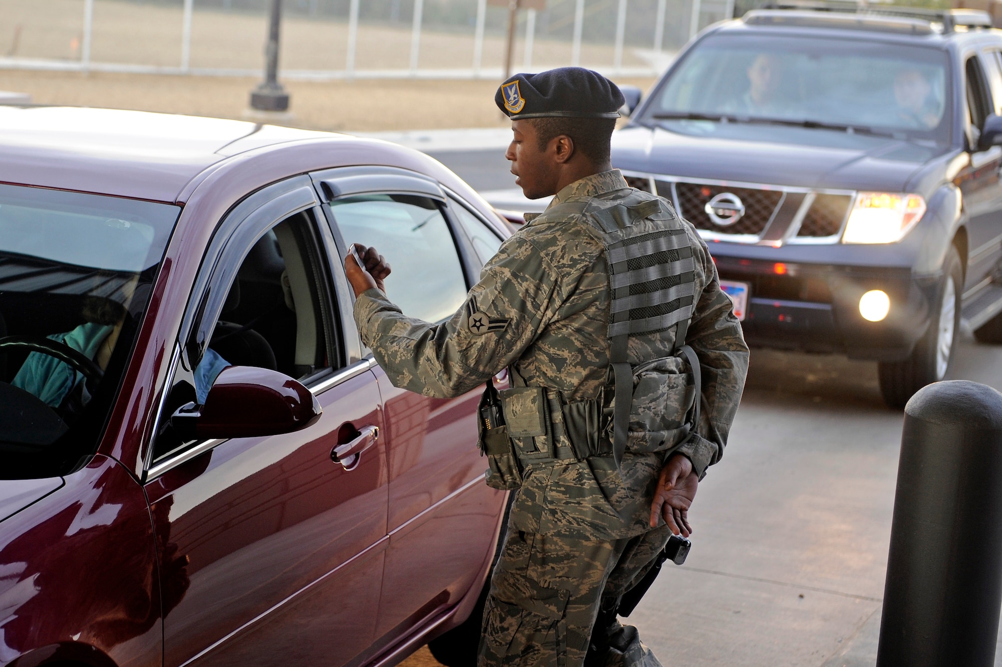 ELLSWORTH AIR FORCE BASE, S.D. -Airman 1st Class Derrick Marlin, 28th Security Forces Squadron Alpha Flight member, conducts identification checks for base entry at the Patriot Gate, Sept. 8.  Ensuring only authorized access to the base acts as a first security measure to protect all base assets. (U.S. Air Force photo/Staff Sgt. Marc I. Lane)