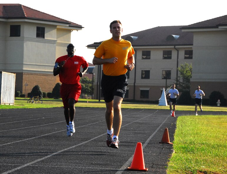Squadron Office School faculty member Capt.Tony Bean (left), chief, Standardization and Evaluation/International Officer Liaison, and Lt. Cmdr. Matthew Olson, U.S. Navy, a student at the Air Command and Staff College, ran laps Tuesday morning at the Officer Training School track.The OTS track will close Wednesday until Oct. 28 for resurfacing. To request information about alternate running locations on base, including the river run and the warrior run course, call the Maxwell Fitness Center at 953-5954. (Air Force photo/Airman 1st Class Christopher S. Stoltz)