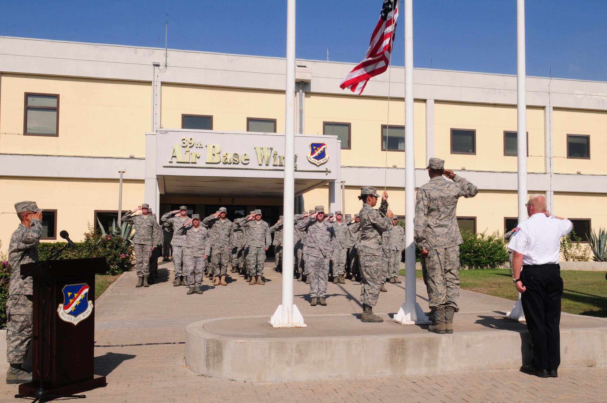 Incirlik Airmen salute during a Patriot Day retreat ceremony Sept. 10, 2010 at Incirlik Air Base, Turkey.  The ceremony recognized the service of first responders and included a moment of silence and taps to honor those who lost their lives during the Sept. 11 attacks.  (U.S. Air Force photo by Senior Airman Ashley Wood/Released)