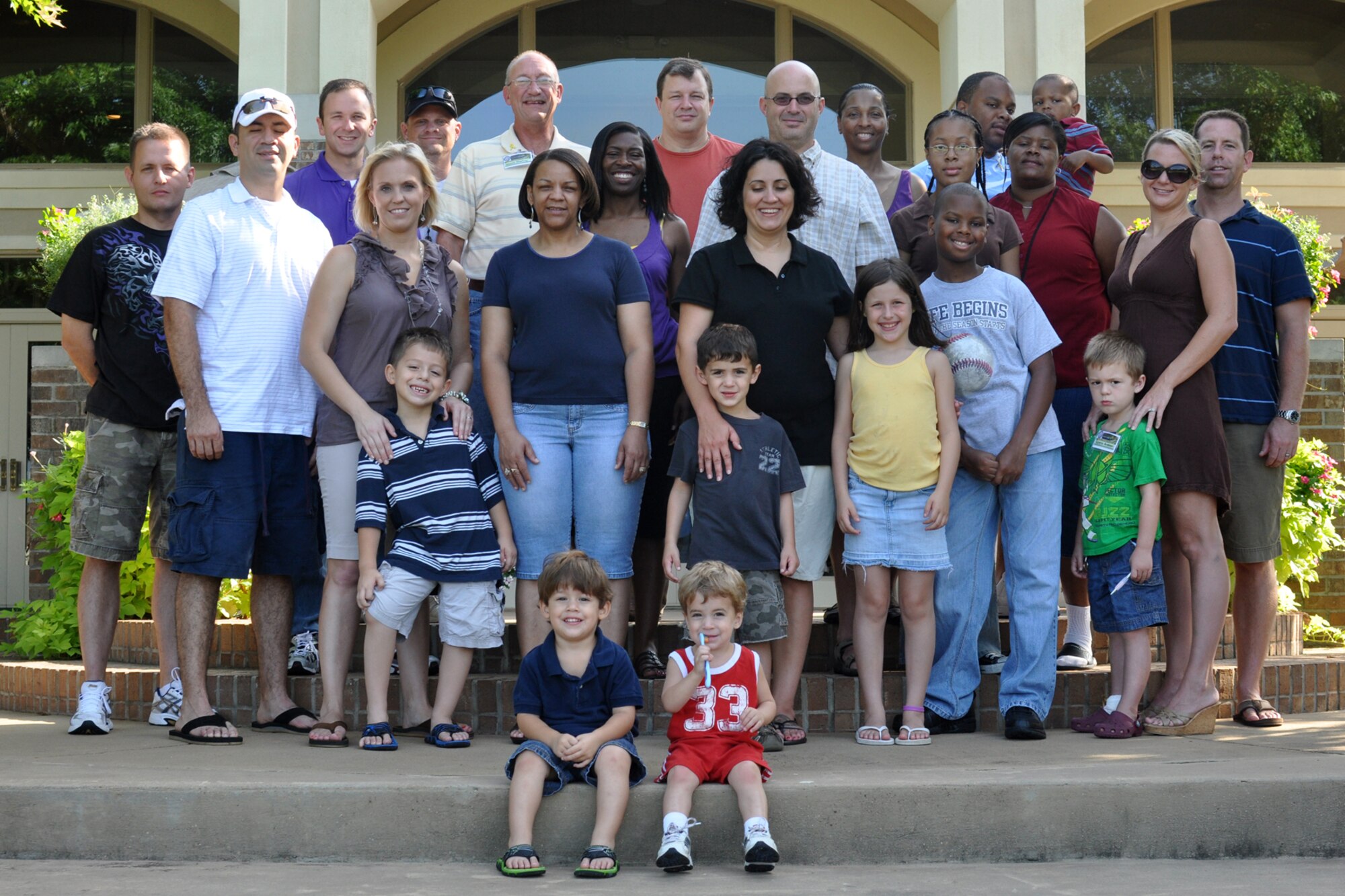 Yellow Ribbon Program participants stand together, capturing a moment in time from a memorable weekend at the Cypress Bend Resort, Many, La., Aug. 14, 2010. Recently deployed members of the 917th Wing and their families received the opportunity to talk, learn and connect with other recently-deployed members and representatives and volunteers from various Department of Defense organizations during their weekend. The YRP, a tasking from the Department of Defense, aids in reintegrating Soldiers, Sailors, Airmen and Marines back to their state-side lives after returning from a deployed environment. (No unauthorized persons) (U.S. Air Force photo/Senior Airman Crystal Jordan)