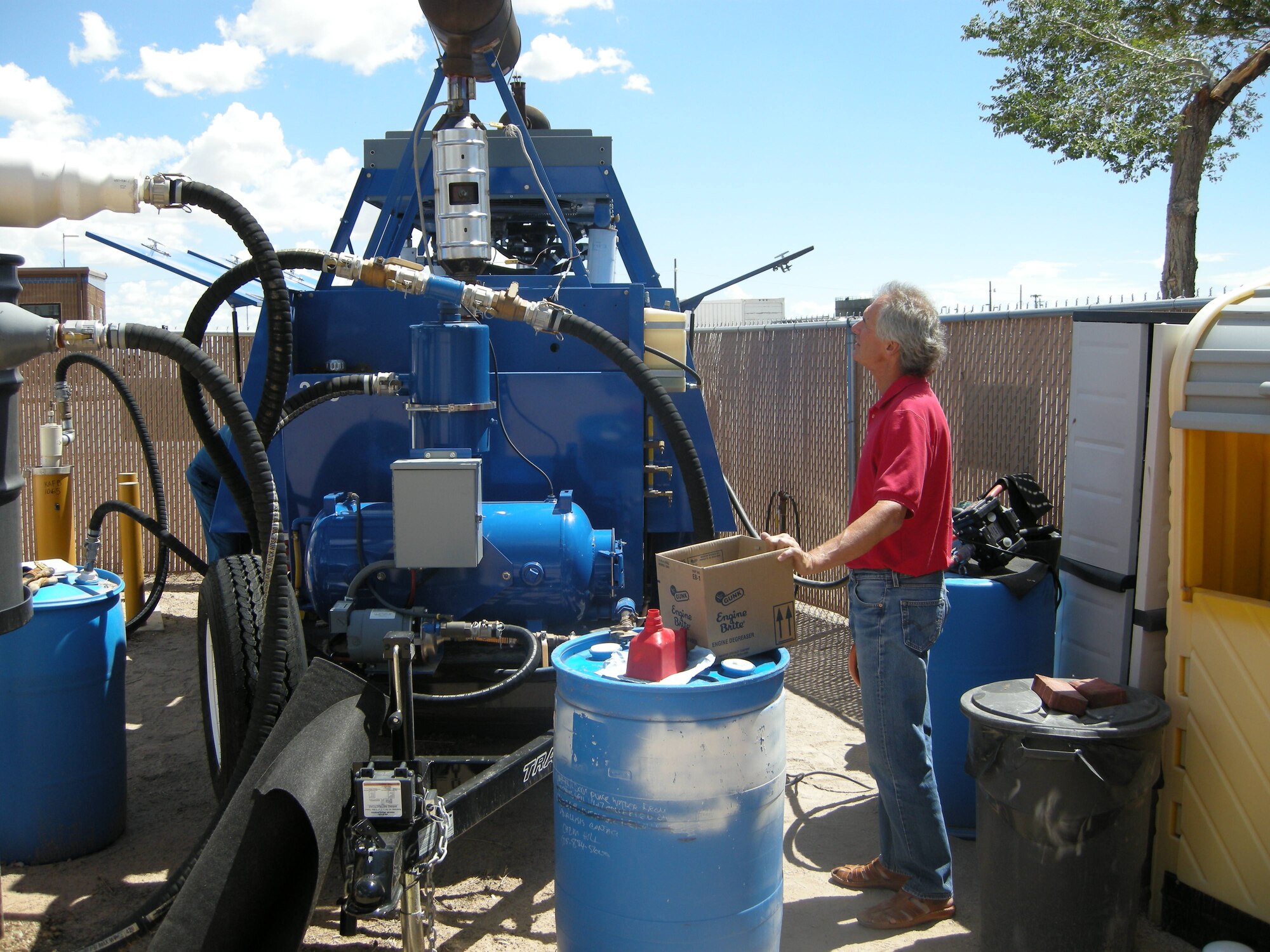 Mark Holmes, hydrogeologist, 377th Civil Engineering Division monitors the base’s second soil vapor extraction unit, which was installed in August 2008 to assist in the remediation of the fuel leak.  U.S. Air Force Photo by Michael Kleiman.