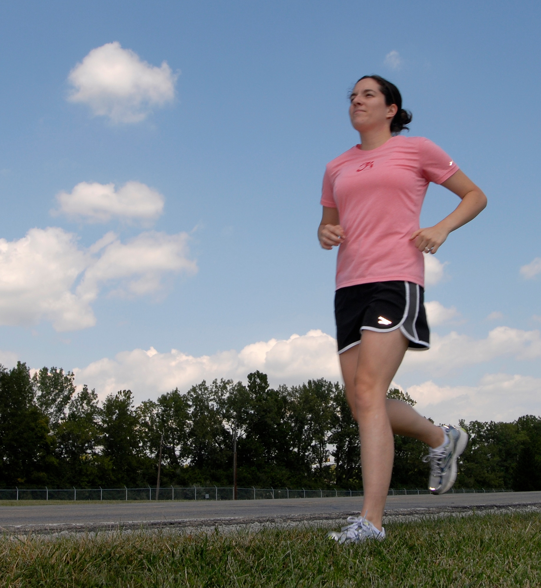 WRIGHT-PATTERSON AIR FORCE BASE, Ohio - Senior Airman Natalie Hopkins, 445th Airlift Wing Command Post, prepares for the Air Force Marathon on a practice run Aug. 18.  Airman Hopkins is running in the marathon in honor of her late brother, Sgt. Jon Stiles. (U.S. Air Force photo/Maj. Jose Cardenas)