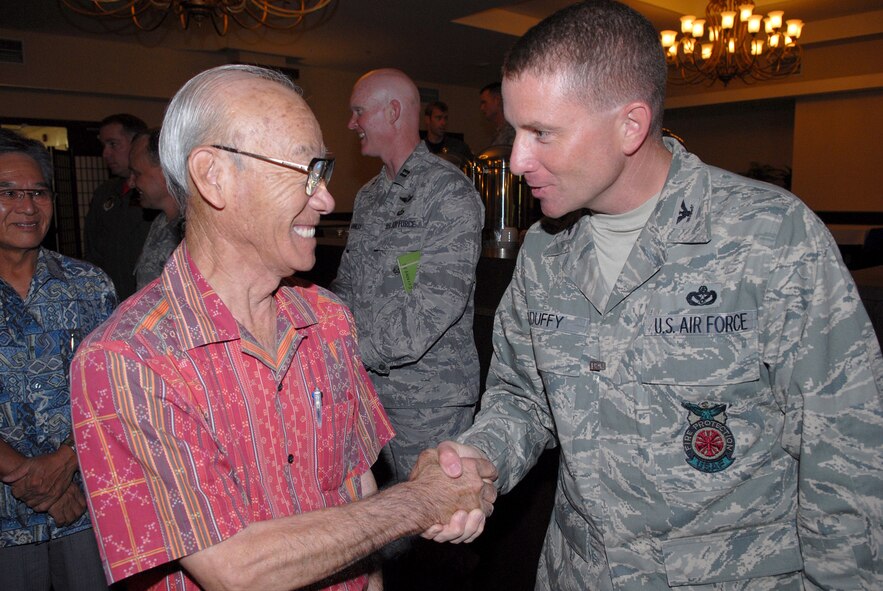 Colonel Brian Duffy, 18th Civil Engineer Group commander, greets Mr.Choki Yogi, 18th CEG Co-Commander, Sept. 10 during the Kadena Co-Commanders' tour. Dozens of local lecaders visited the base to gain better understanding of Kadena's mission and people. (U.S. Air Force Photo/ Junko Kinjo)