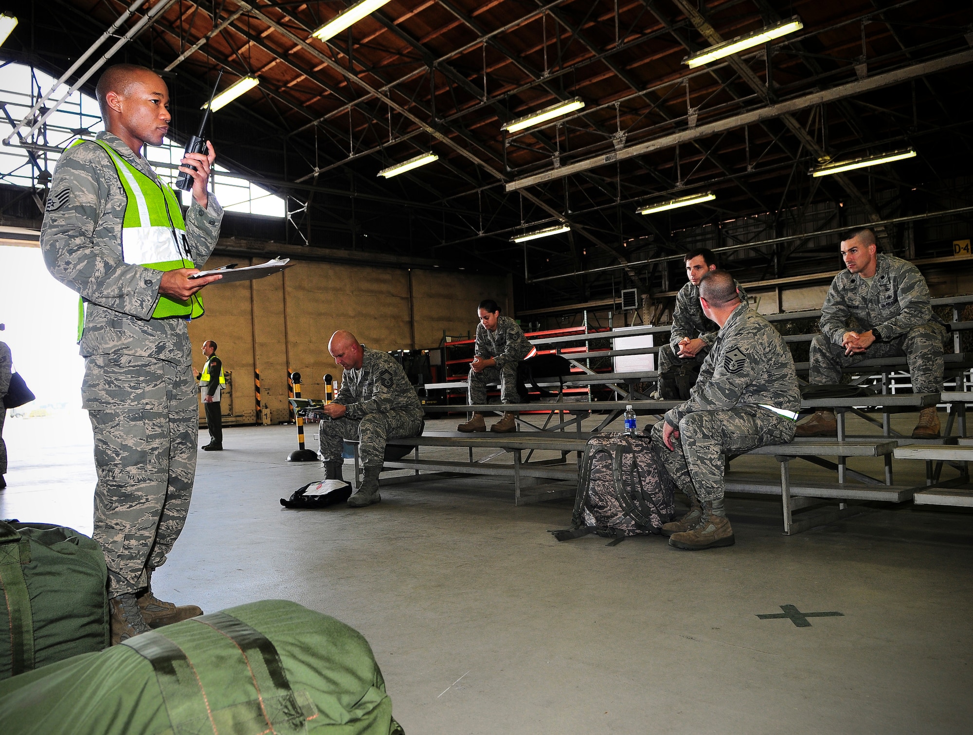 YOKOTA AIR BASE, Japan -- Airmen at Yokota Air Base prepare to inspect their mobility bags for a simulated deployment, Sep. 9. The Operational Readiness Exercise was held to test the 374th Airlift Wing’s capabilities to rapidly provide humanitarian assistance to our neighbors and partners in the Pacific area of responsibility. (U.S. Air Force photo by Staff Sgt Stacy Moless)