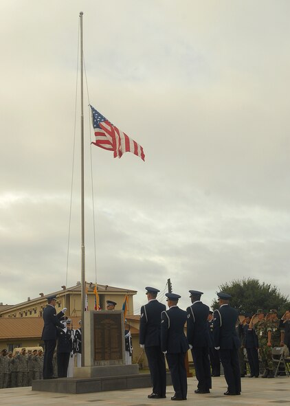 KUNSAN AIR BASE, Republic of Korea -- 8th Fighter Wing honor guard members raise the flag to half staff during the Sept. 11 Patriot Day Remembrance Ceremony here Sept. 10. The ceremony was in honor of the victims from Flights 11, 175, 77, 93, the Pentagon, the World Trade Center North and South tower employees, and emergency service workers, who were killed in the events in America Sept. 11, 2001. (U.S. Air Force photo/Senior Airman Ciara Wymbs)