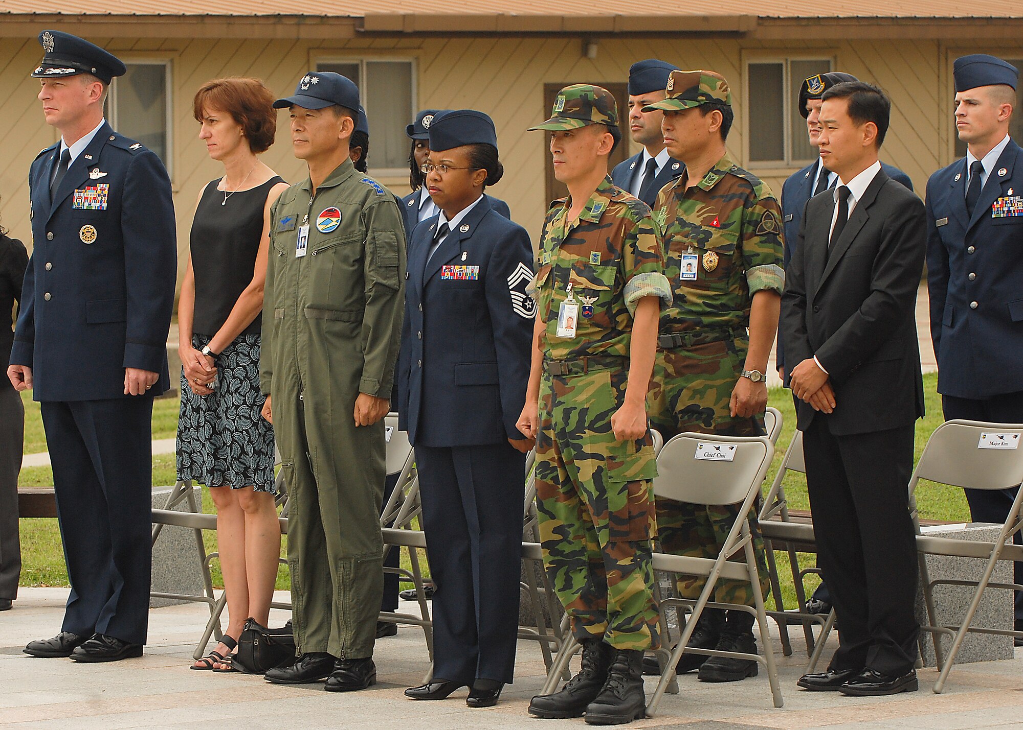 KUNSAN AIR BASE, Republic of Korea -- 8th Fighter Wing and Republic of Korea Air Force leadership stand for the singing of the national anthem during the Sept. 11 Patriot Day Remembrance Ceremony here Sept. 10. The ceremony was in honor of the victims from Flights 11, 175, 77, 93, the Pentagon, the World Trade Center North and South tower employees, and emergency service workers, who were killed in the events in America Sept. 11, 2001. (U.S. Air Force photo/Senior Airman Ciara Wymbs)