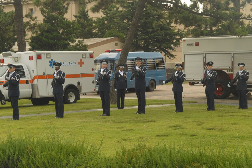 KUNSAN AIR BASE, Republic of Korea -- 8th Fighter Wing honor guard firing team members render a salute during the Sept. 11 Patriot Day Remembrance Ceremony here Sept. 10. The ceremony was in honor of the victims from Flights 11, 175, 77, 93, the Pentagon, the World Trade Center North and South tower employees, and emergency service workers, who were killed in the events in America Sept. 11, 2001. (U.S. Air Force photo/Senior Airman Ciara Wymbs)
