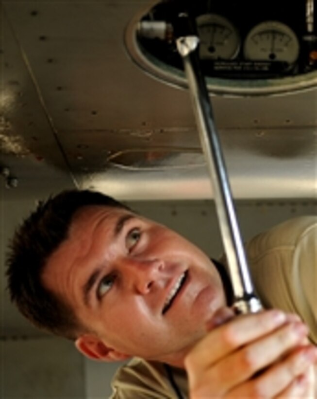 U.S. Air Force Master Sgt. John Bell, a production superintendent with the 67th Aircraft Maintenance Unit, Kadena Air Base, Okinawa, Japan, pumps a jet fuel starter on an F-15 Eagle aircraft before the aircraft departs for Valiant Shield, a joint training exercise in Guam on Sept. 8, 2010.  More than 18 aircraft and 600 Kadena Air Base members were deployed in support of this biannual exercise.  