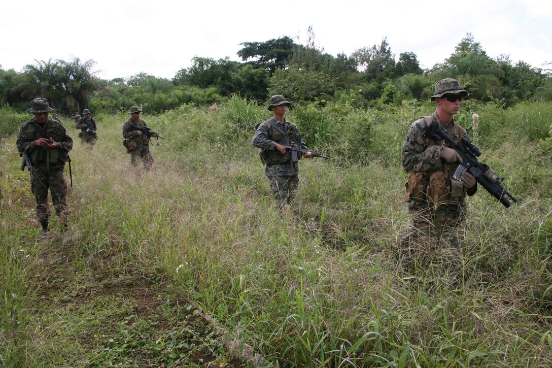 U.S. Marines and Guatemalan Army Special Forces soldiers or "Kaibiles" begin a jungle patrol exercise aboard Poptun Training Camp in Poptun, Guatemala, Sept. 11. From Sept. 5-12, Marines of Special-Purpose Marine Air-Ground Task Force Continuing Promise 2010 conducted a subject-matter expert exchange with Kaibil soldiers to give the Marines a sense of how the elite Guatemalan Special Forces soldiers train on a daily basis.