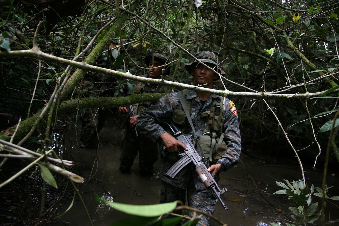 Guatemalan Army Special Forces soldiers or "Kaibiles" lead a jungle patrol exercise for U.S. Marines at Poptun Training Camp in Poptun, Guatemala, Sept. 11.  From Sept. 5-12, Marines of Special-Purpose MAGTF Continuing Promise 2010 conducted a subject-matter expert exchange with Kaibil soldiers to give the Marines a sense of how the elite Guatemalan Special Forces soldiers train on a daily basis.
