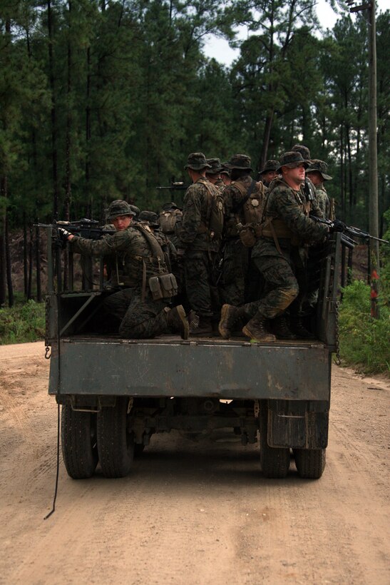 U.S. Marines prepare to make a hasty exit from a Guatemalan military vehicle during an ambush exercise aboard Poptun Training Camp in Poptun, Guatemala, Sept. 12.  Ambushing was part of a larger training package created by the Kaibil soldiers to give Marines of Special-Purpose Marine Air-Ground Task Force Continuing Promise 2010 a sense of how the elite Guatemalan Special Forces soldiers train on a daily basis.