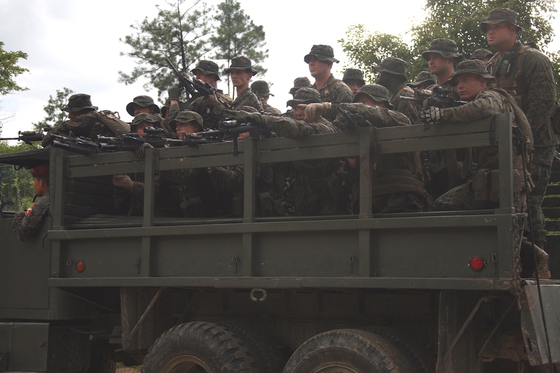 U.S. Marines locate and make contact with the enemy from a Guatemalan military vehicle during an ambush exercise aboard Poptun Training Camp in Poptun, Guatemala, Sept. 12.  Ambushing was part of a larger training package created by the Kaibil soldiers to give Marines of Special-Purpose Marine Air-Ground Task Force Continuing Promise 2010 a sense of how the elite Guatemalan Special Forces soldiers train on a daily basis.