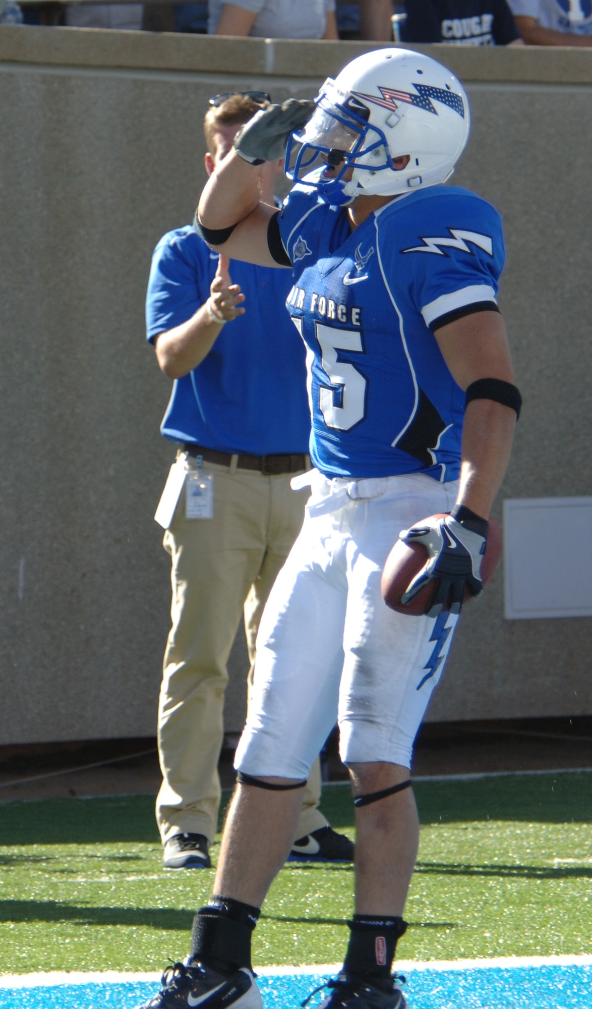Air Force wide receiver Jonathan Warzeka salutes the crowd at Falcon Stadium after scoring a touchdown against the BYU Cougars Sept. 11, 2010. Warzeka, a second-class cadet and native of Lake Elsinore, Calif., had 62 yards on six carries, including a career-long 46-yard dash for a TD on fourth and 2. (U.S. Air Force photo/Staff Sgt. Raymond Hoy)