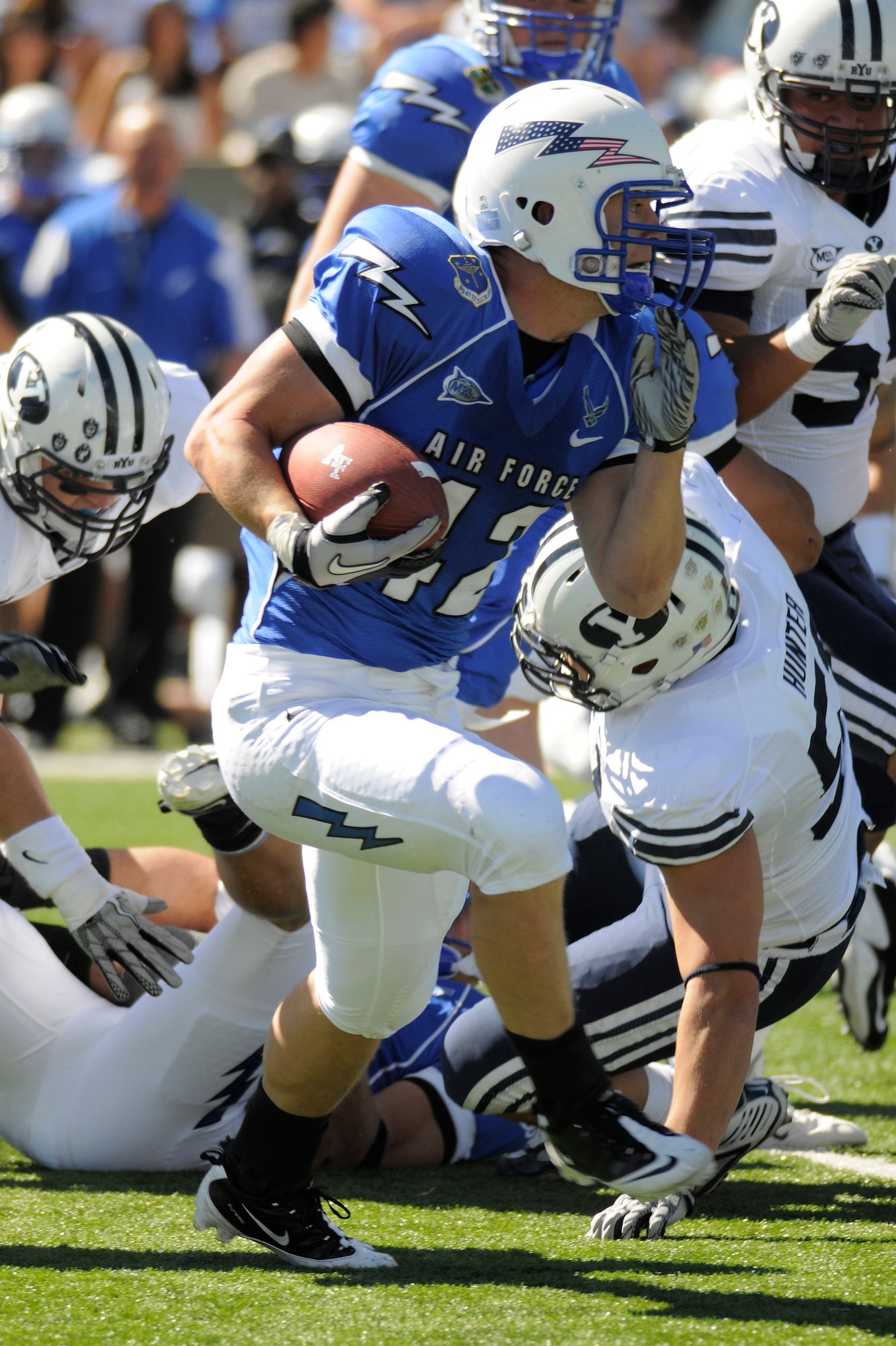 Falcons running back Jared Tew evades a tackle by Cougars linebacker Shane Hunter in Air Force's 35-14 victory over BYU at Falcon Stadium Sept. 11, 2010. Tew, a first-class cadet and native of Park City, Utah, had 77 yards on 17 carries against the Cougars. (U.S. Air Force photo/Bill Evans)
