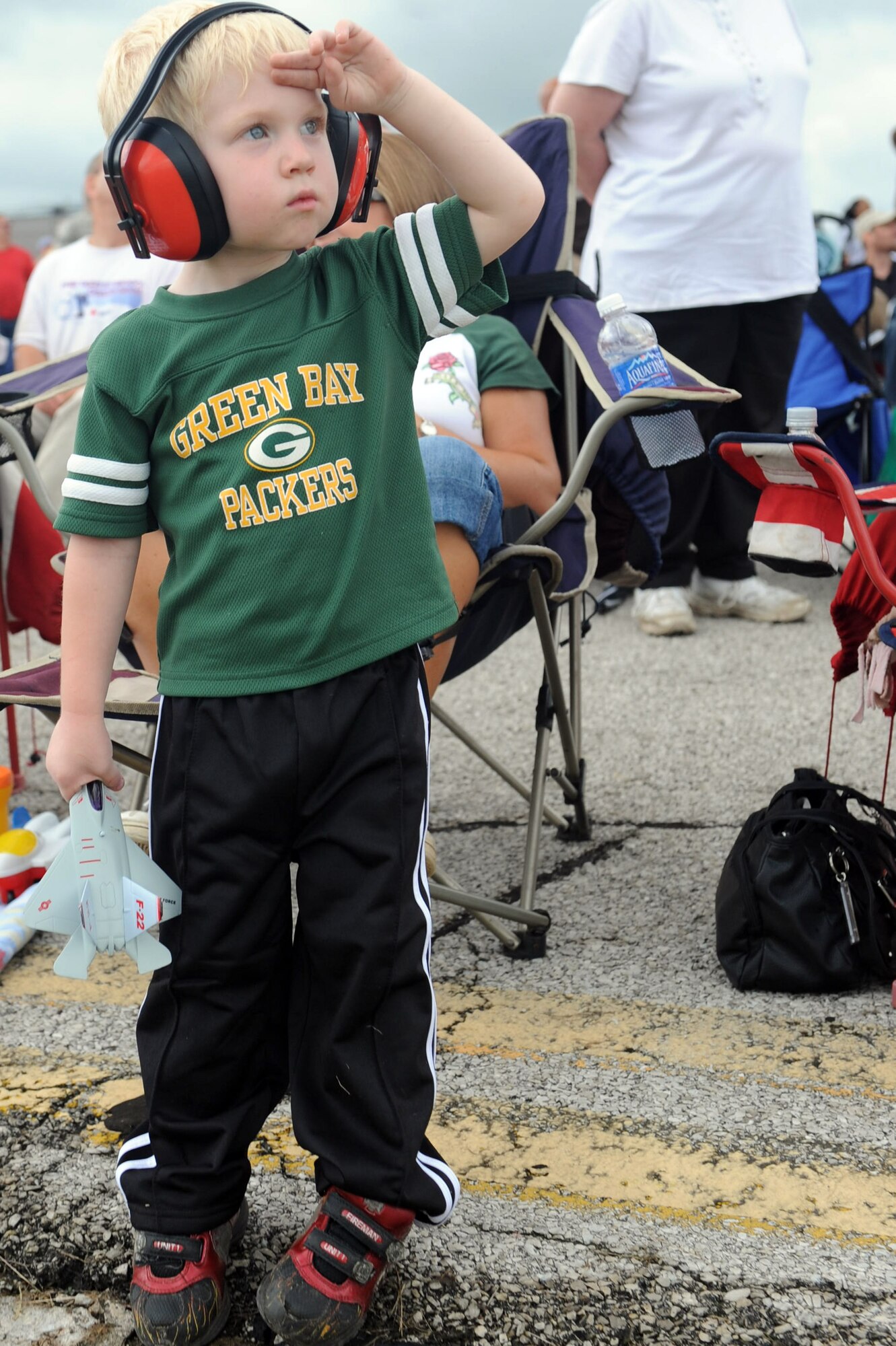 SCOTT AIR FORCE BASE, Ill. -- Tom Frame, 2, salutes during the 2010 Airpower Over the Midwest Air Show while the National Anthem is performed. (U.S. Air Force photo/Tech. Sgt. Michelle Larche) 