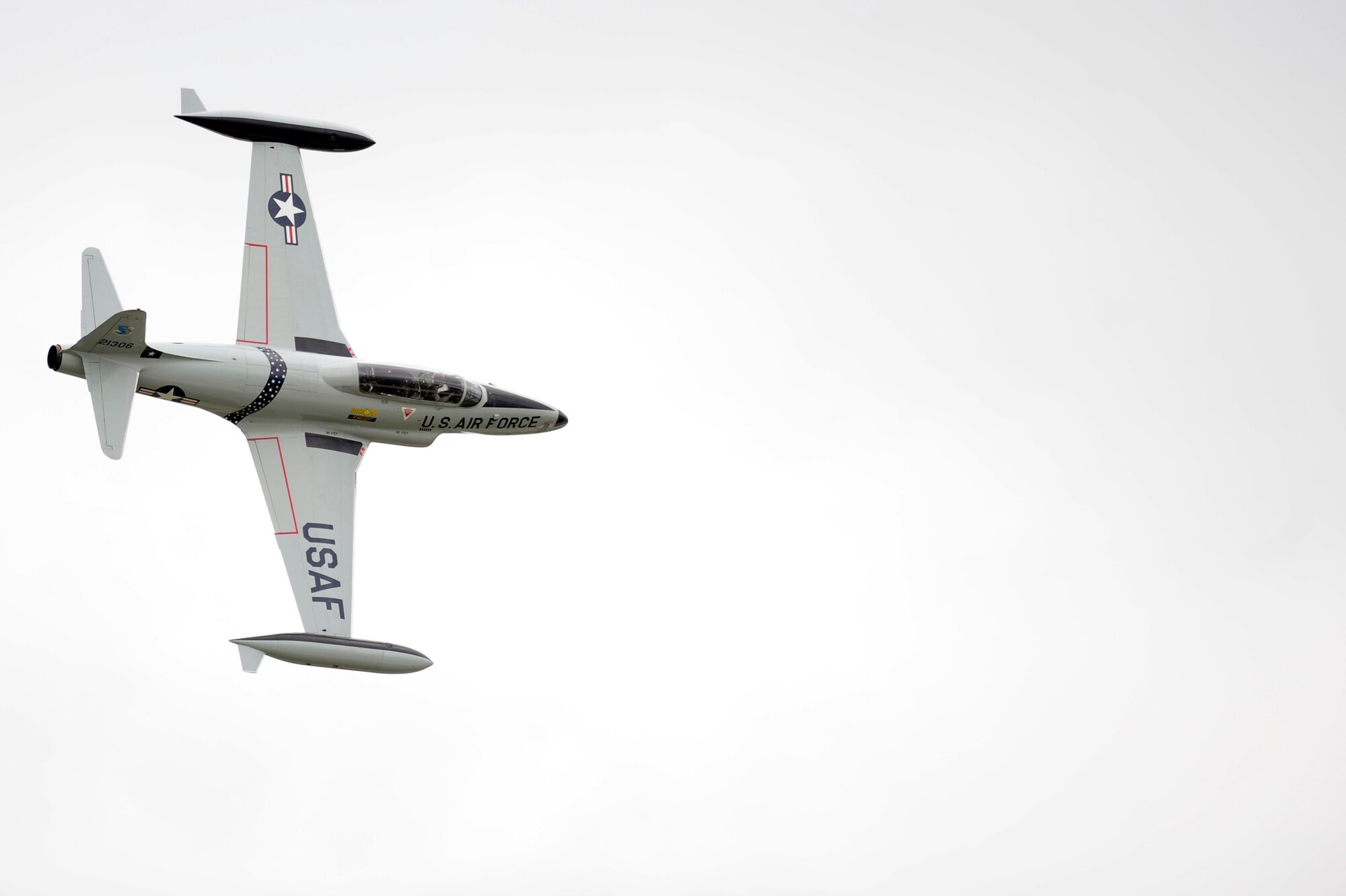 SCOTT AIR FORCE BASE, Ill. -- A T-33 wows the crowd with flips and high-speed turns during the 2010 Airpower Over the Midwest Air Show Sept. 11. The event featured planes in the sky and planes on the ground along with many other displays showcasing military power from the past and present. (U.S. Air Force photo/Staff Sgt. Ryan Crane)