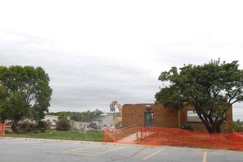 Demolition of Building 107, at the 132nd Fighter Wing, Iowa Air National Guard Base, located at the Des Moines International Airport begins in earnest Wednesday, September 9, 2010. Building 107, originally built in 1959, went through numerous remodels and was once home to the Flight Simulator, Recruiting, Finance, Comptroller, Contracting, Communications Flight, and Mission Support Group Commander.  The building was no longer needed after the tenants were relocated. (U.S. Air Force photo/Senior Master Sgt. Tim Day)(released)