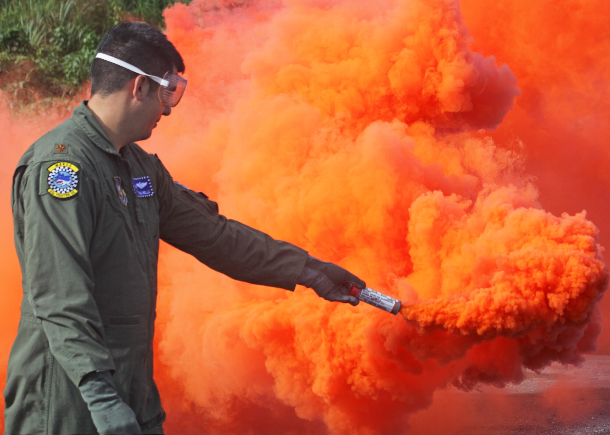 Maj. Paul Wells, 93rd Fighter Squadron Mako pilot,  gets familiar with using a MK13 MOD 0 Signal Flare during Combat Survival Training at Homestead Air Reserve Base, Sep 11.  The training was part of a 2-day event that included signalling, survival kit familiarization, land navigation and land and water survival training. (U.S. Air Force photo/ Tech. Sgt. Ian Carrier)