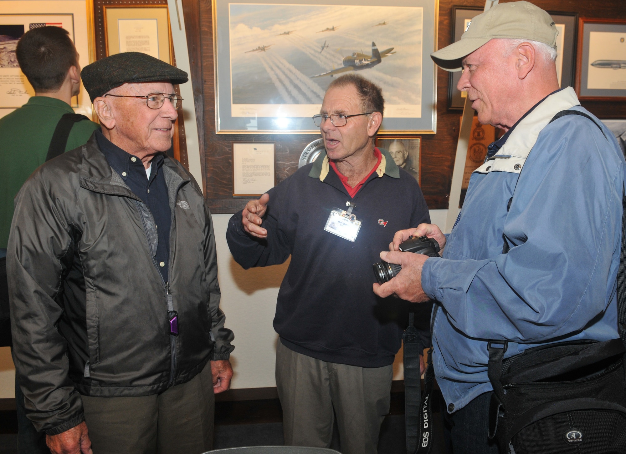 Capt. (ret.) Robert Shoens, pilot of the B-17 'Our Gal Sal,' Ron Batley, Thorpe Abbotts museum curator, and Robert Shoens Jr., discuss the way the airfield has changed over the years, Sept. 11, 2010. Mr. Batley and Captain Shoens were able to enlighten each other on various aspects. (U.S. Air Force photo/Tech. Sgt. Kevin Wallace)