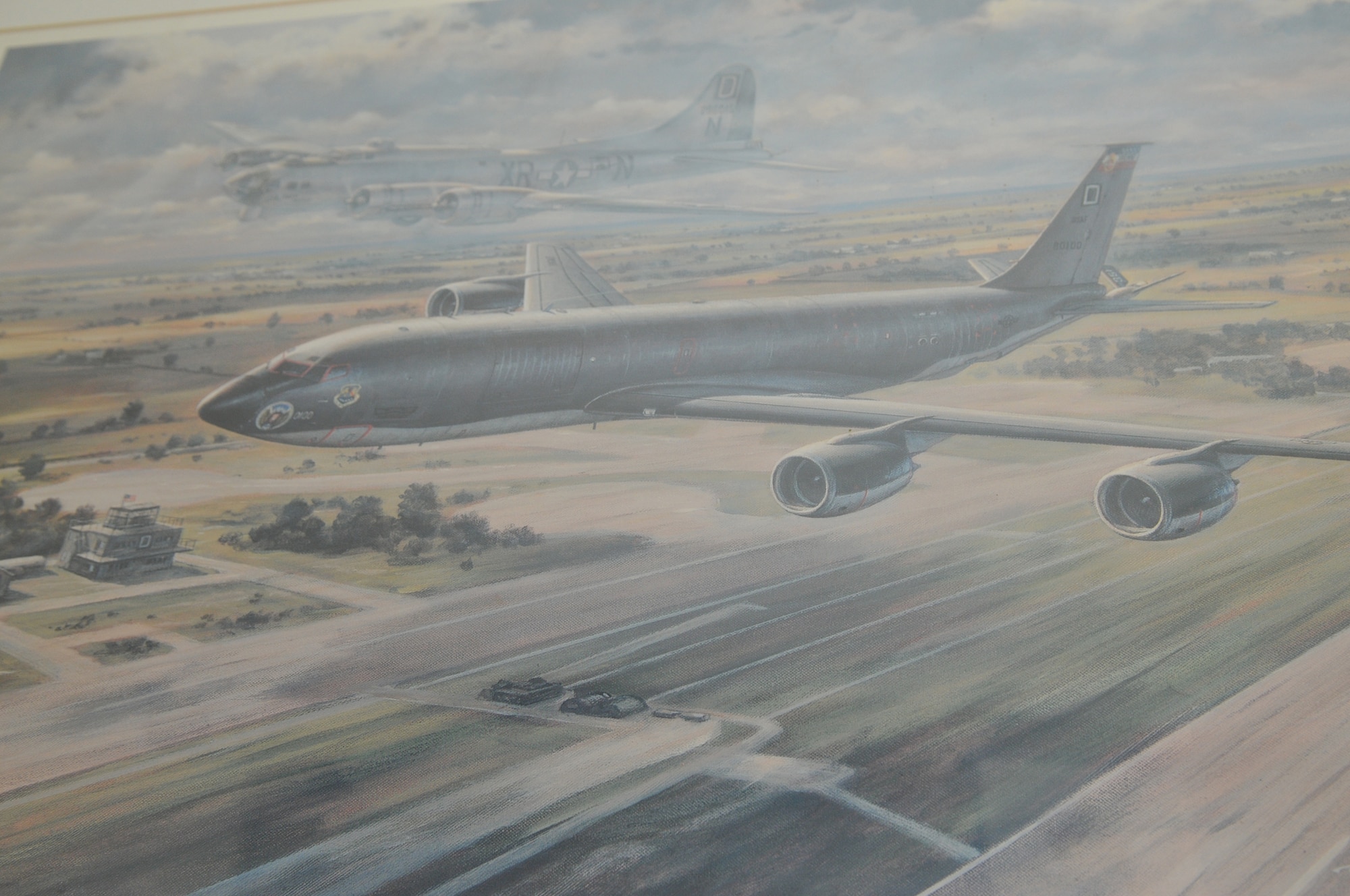 A painting titled "The 'Bloody 100th' - Yesterday and Today" is on display at the museum at Thorpe Abbotts, a former Royal Air Force airfield during World War II, which was home to the 100th Bomb Group. That bomb group moved to RAF Mildenhall and is now the 100th Air Refueling Wing. The KC-135 Stratotankers at RAF Mildenhall are still painted using the legendary Bloody 100th tail flashes. The painting, which was reproduced from the original by Ronald T.K. Wong April 1993, was given to the 100th ARW and depicts a ghost of the B-17 of the World War II era flying beside a 100th ARW KC-135. (U.S. Air Force photo/Tech. Sgt. Kevin Wallace)