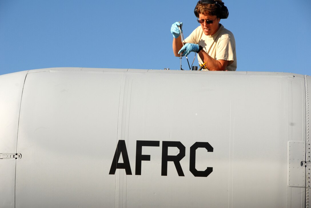 Tech. Sgt. Carolyn Schaefer, 442nd Aircraft Maintenance Squadron crew chief, checks the oil in an A-10C Thunderbolt II turbo-fan engine Aug. 31 at Hill Air Force Base, Utah, following a trainig sortie.  Sergeant Schaefer is part of the 442nd Fighter Wing, an Air Force Reserve unit based at Whiteman Air Force Base, Mo.  Approximately 70 reservists from the wing deployed to Hill AFB for training on the Utah Test and Training Range.  (U.S. Air Force photo/Lt. Col. David Kurle)