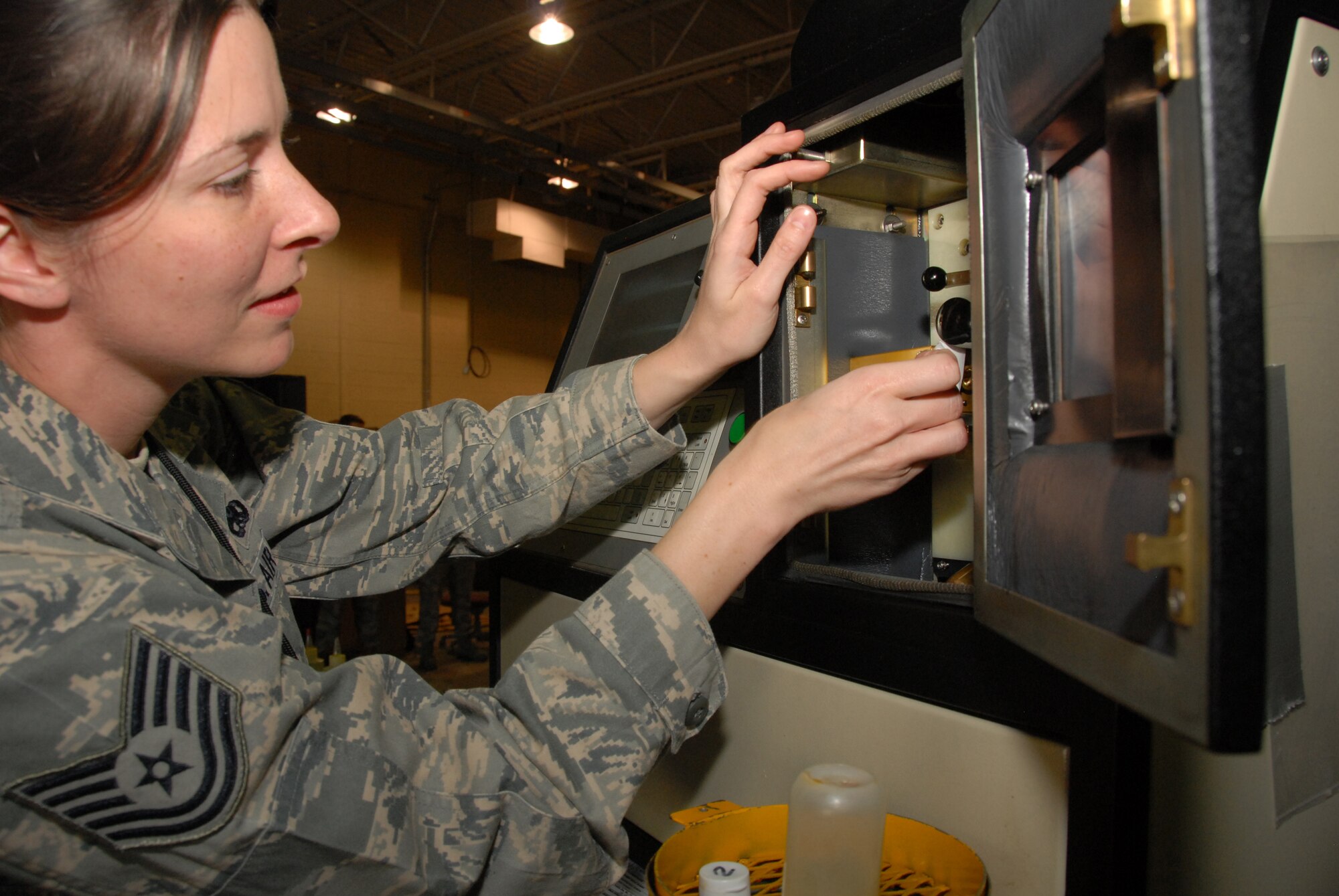 Tech. Sgt. Kathy Morrison cleans a spectrometer after analyzing engine oil from an A-10C Thunderbolt II Aug. 30 at Hill Air Force Base, Utah.  Sergeant Morrison is works in the non-destructive inspection section of the 442nd Maintenance Squadron, part of the 442nd Fighter Wing, based at Whiteman Air Force Base, Mo.  She was one of approximately 70 Air Force Reservists from the wing who deployed to Hill to support live-munitions training for the wing's pilots.  Sergeant Morrison uses the spectrometer to look for anomolies in oil samples taken from the A-10's turbo-fan engines.  In particular, she looks for small pieces of metal that might indicate certain engine parts are breaking down.  (U.S. Air Force photo/Lt Col David Kurle)