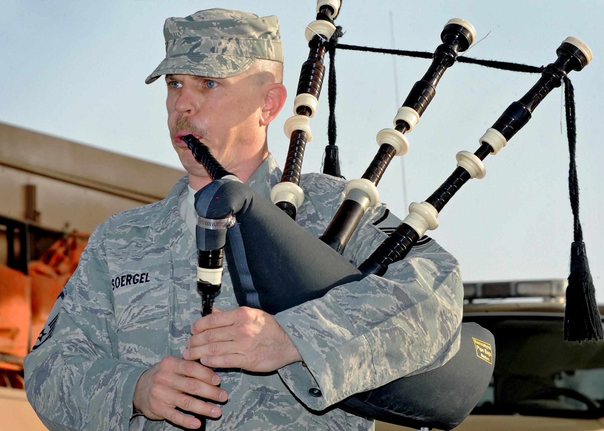 SOUTHWEST ASIA - Master Sgt. Peter Soergel of the 386th Expeditionary Civil Engineer Squadron plays the bagpipes during a 9/11 memorial service at an undisclosed air base here Sept. 11, 2010. The ceremony was held in tribute to the nearly 3,000 men and women who lost their lives during terrorist attacks on the United States on Sept. 11, 2001. (U.S. Air Force photo by Senior Airman Laura Turner)