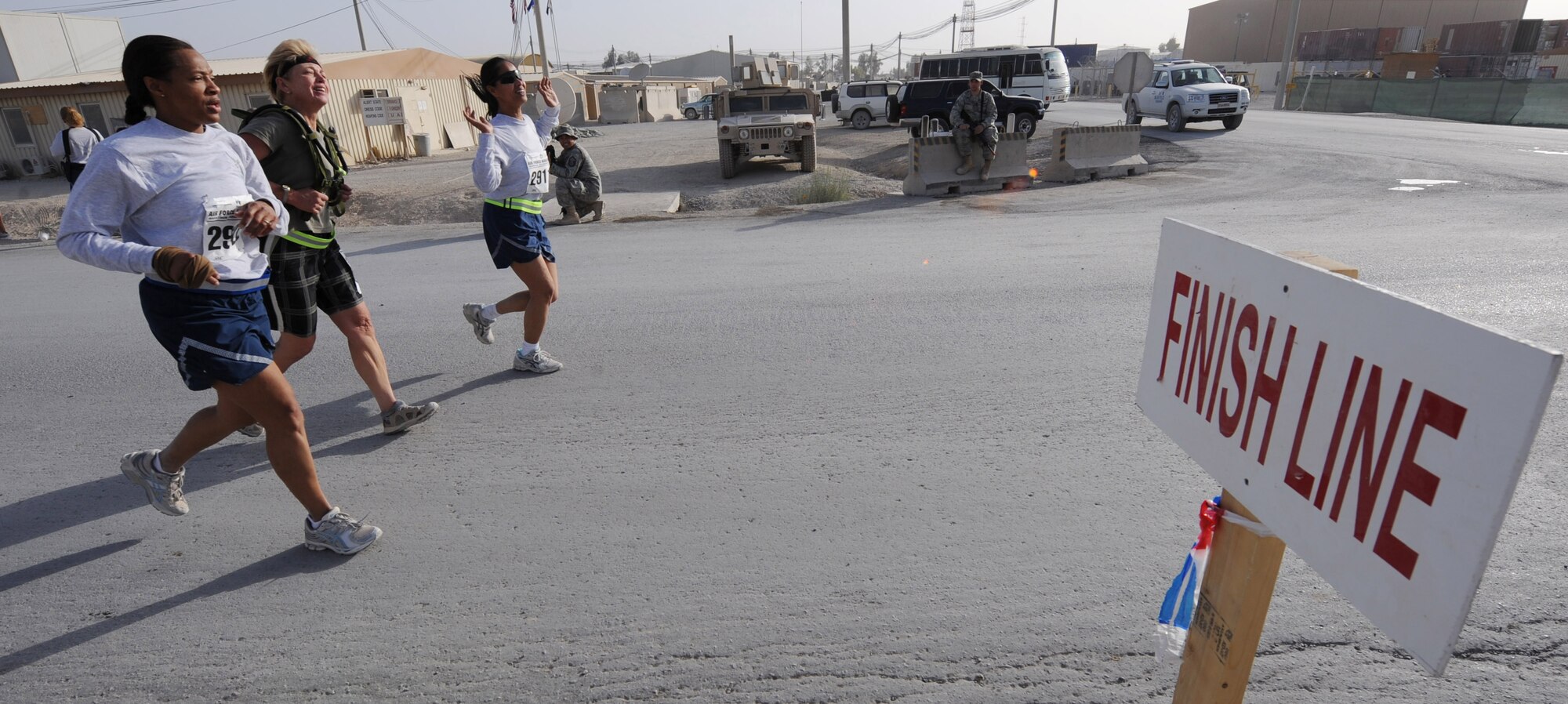 Airmen participating in the Air Force Marathon cross the finish line Sept. 11, 2010 at Kandahar Airfield, Afghanistan. This year marks the 14th stateside Air Force Marathon and the fourth at overseas locations.  (U.S. Air Force photo by Tech. Sgt. Chad Chisholm/Released)