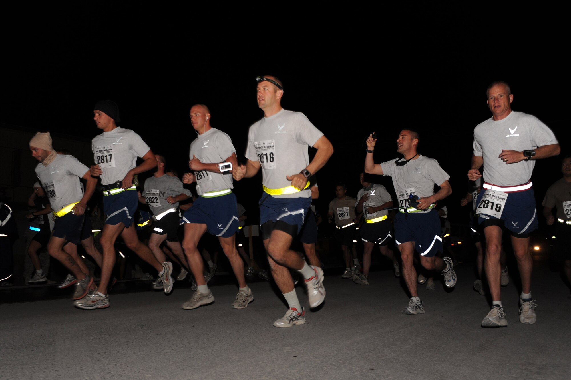 Airmen participating in the Air Force Marathon start the race early in the morning Sept. 11, 2010, at Kandahar Airfield, Afghanistan. This year marks the 14th stateside Air Force Marathon and the fourth at overseas locations.  (U.S. Air Force photo by Tech. Sgt. Chad Chisholm/Released) 