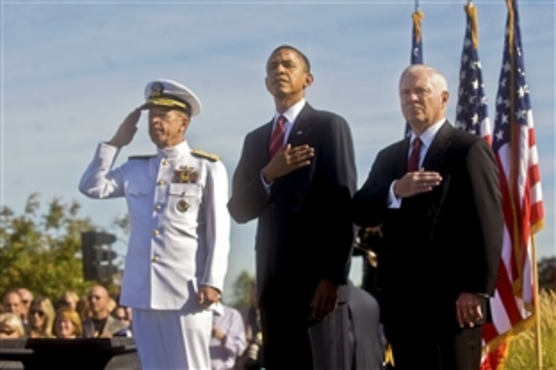 U.S. Navy Adm. Mike Mullen, chairman of the Joint Chiefs of Staff, President Barack Obama and Defense Secretary Robert M. Gates render honors, Sept. 11, 2010, during the playing of the national anthem at the Pentagon Memorial during a ceremony marking the ninth anniversary of the Sept. 11, 2001, attacks.  
