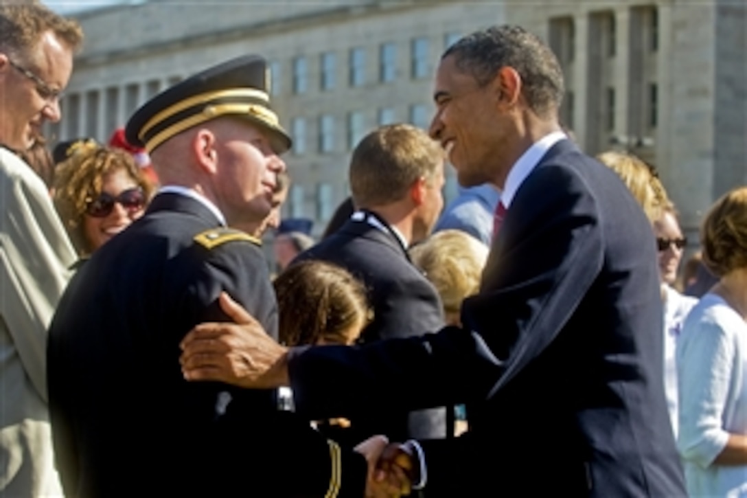 President Barack Obama shakes hands with a servicemember at the Pentagon Memorial, Sept. 11, 2010, following a ceremony marking the ninth anniversary of the Sept. 11, 2001, attacks.