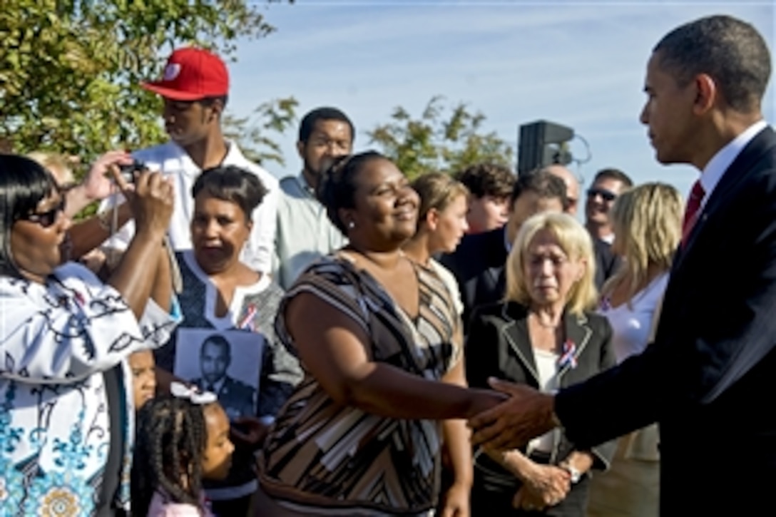 President Barack Obama shakes hands with family members who lost a loved one during the Sept. 11, 2001, terror attack at the Pentagon following a ceremony at the Pentagon Memorial, Sept. 11, 2010, marking the ninth anniversary of the attacks.