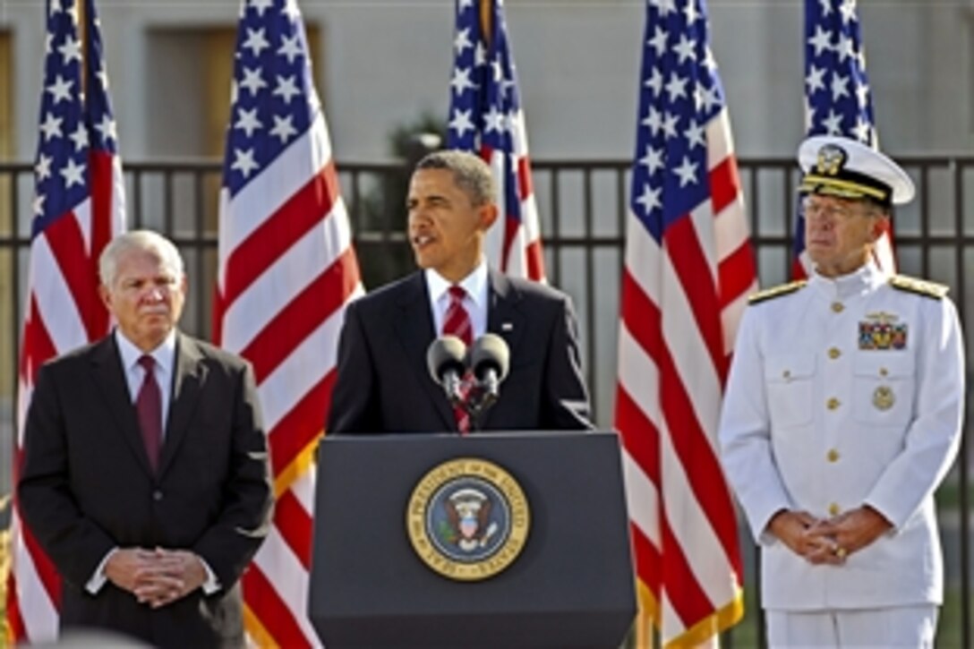 President Barack Obama speaks during a ceremony at the Pentagon Memorial, Sept. 11, 2010, to mark the ninth anniversary of the Sept. 11, 2001, terrorist attacks. Defense Secretary Robert M. Gates, left, and Adm. Mike Mullen, chairman of the Joint Chiefs of Staff, joined Obama at the podium.