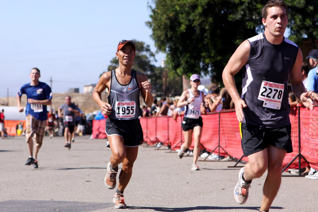 Participants in Camp Pendleton’s 2010 Heartbreak Ridge Half Marathon approach the finish line at base’s 43 Area, Sept. 11. The half marathon is run annually in ordinance with Marine Special Operations Command Hard Corps Race Series and is the fifth of the six races offered for participants. More than 1,000 runners competed for awards in 50 categories in the 13.1 mile course.
