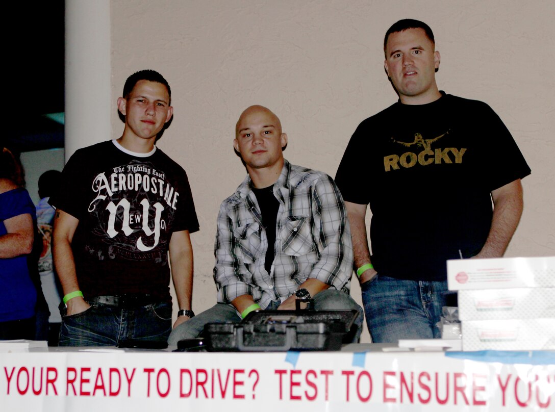 (From left to right) Cordaro Galvan, Robbie Johnson and Brian Purnell, Marines stationed aboard Marine Corps Base Camp Lejeune are members of Project Guardian Angel, a non-profit, anti-drunk driving program that offers transportation alternatives to Marines, sailors and civilians in the Jacksonville, N.C. area who are too intoxicated to get behind the wheel. The three Marines hang out at a local club to raise awareness and educate people on the affects alcohol can have on a person's decision-making and their blood alcohol content.