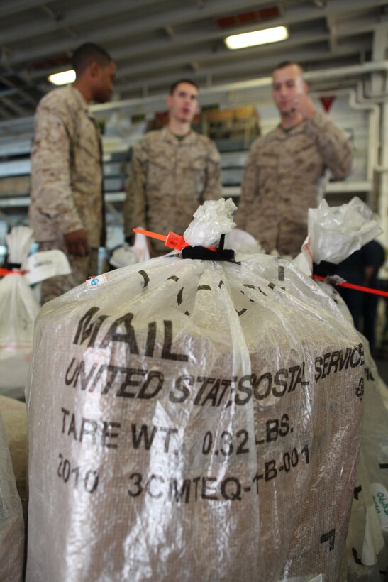 Marines and sailors with 26th Marine Expeditionary Unit received their first batch of mail from friends and loved ones during their first mail call aboard USS Kearsarge in the Mediterranean Sea, Sept. 12, 2010. 26th MEU deployed aboard the ships of Kearsarge Amphibious Ready Group in late August responding to an order by the Secretary of Defense to support Pakistan flood relief efforts.