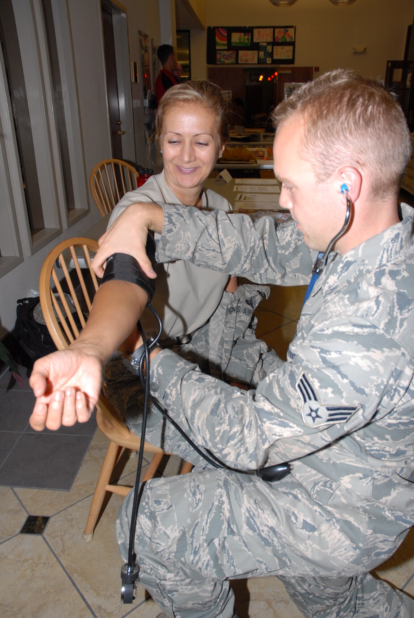 A 940th Services Flight member gets her blood pressure checked by a medical technician with the 940th AeroMedical Flight during the 940th Wing Health Fair, Sept. 11. The event provided Reservists with information on leading a healthy lifestyle from fitness and health experts from the Yuba-Sutter community. (U.S. Air Force photo/Tech. Sgt. Kenneth McCann)