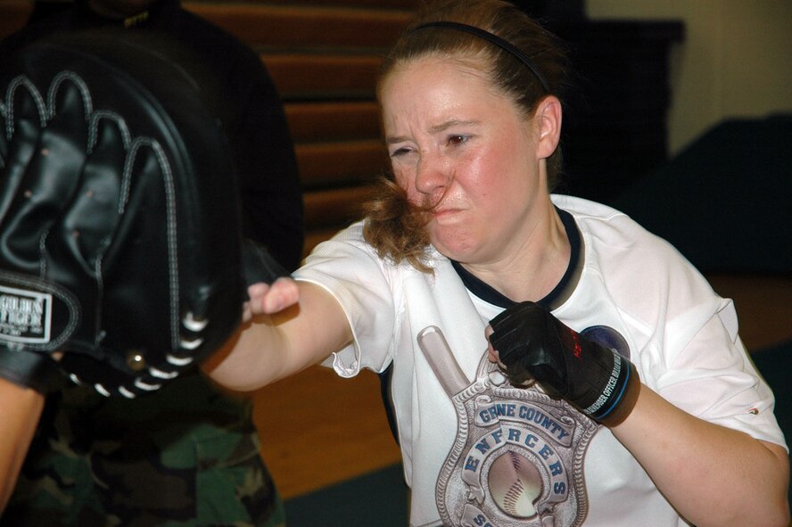 JOINT BASE LEWIS-MCCHORD, Wash. -- Tech Sgt. Vanessa Walsh throws a one-two combo during a defensive tactics refresher training course here Sept. 12, 2010.  Sergeant Walsh and her fellow Reservists from the 446th Security Forces Squadron gained valuable insight into modern defensive tactics during the course.   