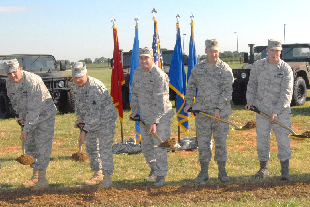 Flanked by leadership from the Oklahoma National Guard, Oklahoma Air National Guard and Will Rogers Air National Guard Base, 146th Air Operations Support Squadron Commander Lt Col Bruce Hamilton begins the ceremonial groundbreaking process of his squadron's new, $4.8 million facility on WRANGB.  The facility is scheduled to be finished in Aug 2012.