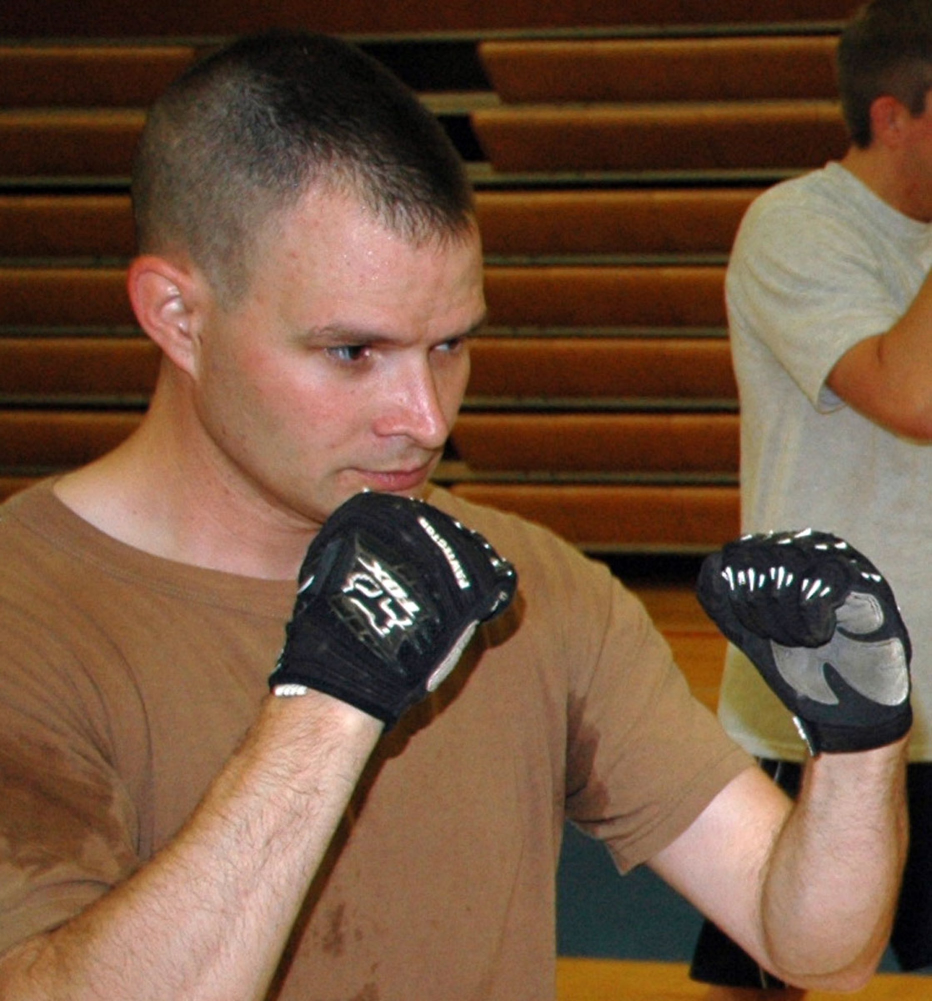 JOINT BASE LEWIS-MCCHORD, Wash. -- Staff Sgt. Damon Hahn readies for a defensive takedown maneuver during a refresher training course here Sept. 12, 2010.  Sergeant Hahn and his fellow Reservists from the 446th Security Forces Squadron gained valuable insight into modern defensive tactics during the course, 