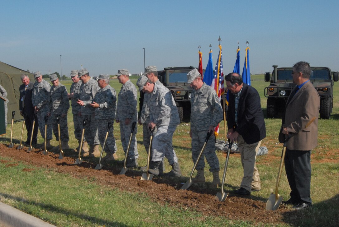 Leadership from the Oklahoma National Guard, Oklahoma Air National Guard and Will Rogers Air National Guard Base aid 146th Air Operations Support Squadron Commander Lt Col Bruce Hamilton in the groundbreaking of his squadron's new, $4.8 million facility.  The facility is scheduled to be finished in Aug 2012.