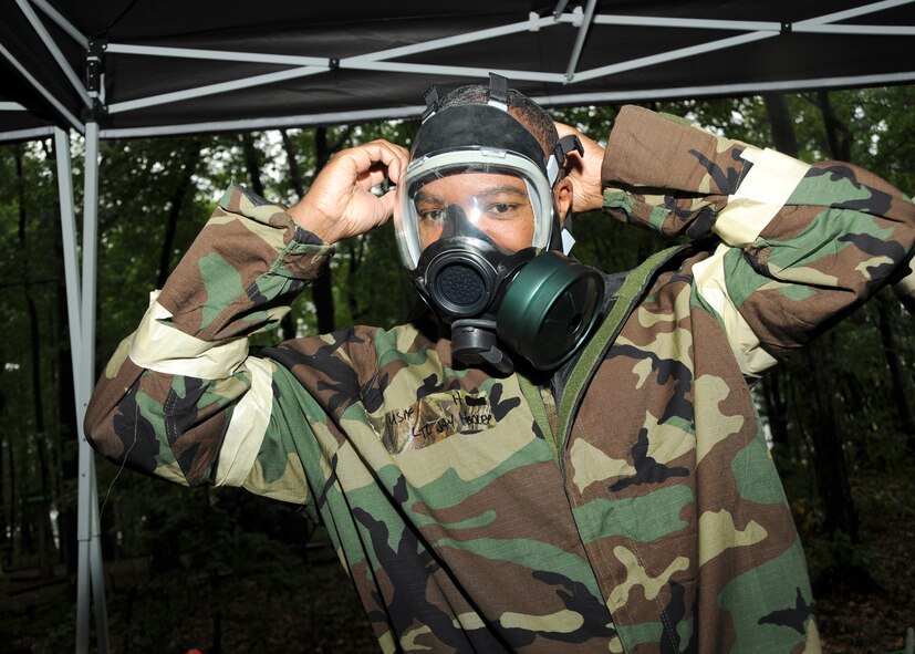 U.S. Air Force Lt. Col. Gerald “Jay” Hedley, an A-10 pilot of the 104th Fighter Squadron, Maryland Air National Guard, puts on his gas mask during Ability to Survive and Operate (ATSO) training on Warfield Air National Guard Base, Baltimore, Md., September 12, 2010. Fifteen personnel from the Readiness and Emergency Management Flight provided ATSO training to over 400 Guard members at seven different stations during the September drill weekend.  (U.S. Air Force photo by Tech Sgt. Christopher Schepers /Released) 