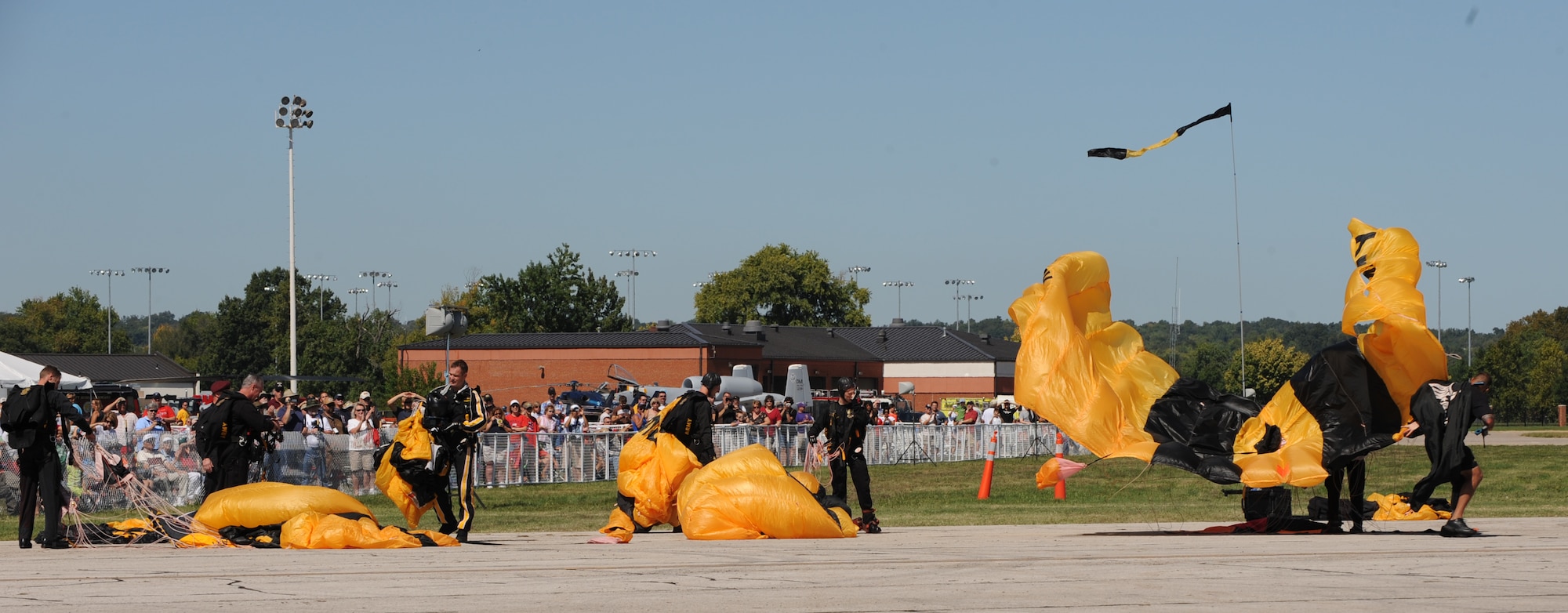 SCOTT AIR FORCE BASE, Ill -- Members of the U.S. Army Golden Knights Gold Team recover their parachutes after a succesful jump during the opening ceremonies of the 2010 Airpower Over the Midwest Air Show Sept. 12. (U.S. Air Force photo by Staff Sgt. Brian Valencia)