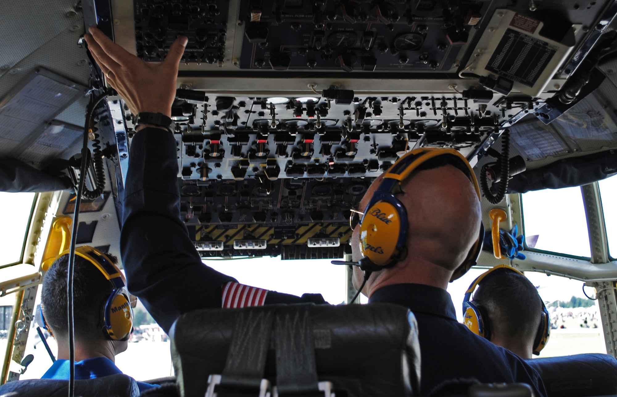 SCOTT AIR FORCE BASE, Ill. – Marine Staff Sgt. Jarred McIntosh, flight engineer, checks the controls during the Blue Angels C-130, Fat Albert, performance at the 2010 Airpower Over the Midwest Air Show Sept. 11. Fat Albert joined the team in 1970 and began opening the Blue Angels demonstration in 1975. (U.S. Air Force photo/Senior Airman Samantha S. Crane)