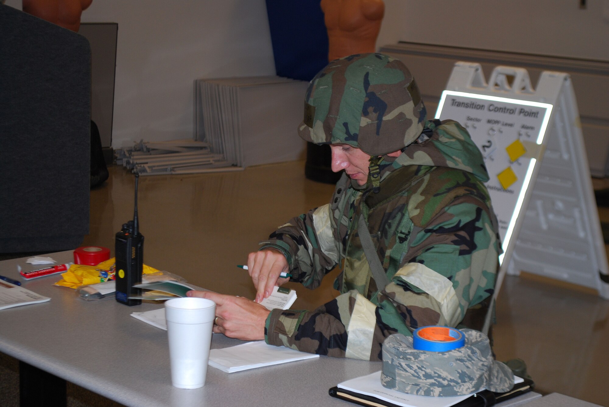 Major Brad Stanley from the 315th Airlift Wing Staff Judge Advocate office prepares for an upcoming, simulated attack during an operational readiness exercise here Sept. 11, 2010. Charleston's operational readiness inspection is scheduled to take place Nov. 29 - Dec. 6, 2011, which signals the beginning of the ORI prep season for Airmen in the 315AW. As part of the preparation emergency managers from throughout 22nd Air Force are here to proactively train Reservists. During this weekend’s unit training assembly multiple exercises were conducted to assess the wing’s ability to survive & operate. (U.S. Air Force photo/Capt. Bryan Lewis)