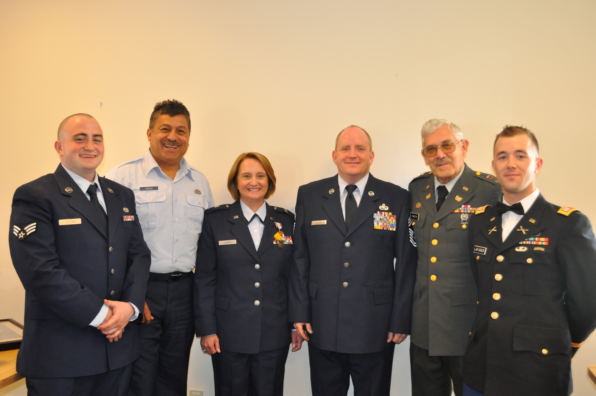 From left to right: Senior Airman Phillip Carter, Senior Master Sgt. Carlos Cardenas, Brig. Gen. Deborah Carter, Chief Master Sgt. Kevin Carter, Chief Warrant Officer Dave Tibbetts, and Capt. Dana Lafarier.