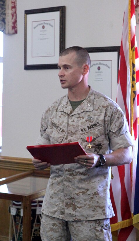 Lt. Col. Guy R. Coursey, the installations and environment operations officer with Installations and Environment Department, Marine Corps Base Camp Lejeune, speaks to service members, colleagues, friends and family members after receiving the Bronze Star medal during a ceremony at John A. Lejeune Hall aboard the base, Sept. 13.  Coursey, an Eagle River, Alaska, native, received the award for his leadership and professionalism while deployed in support of Operation Enduring Freedom.