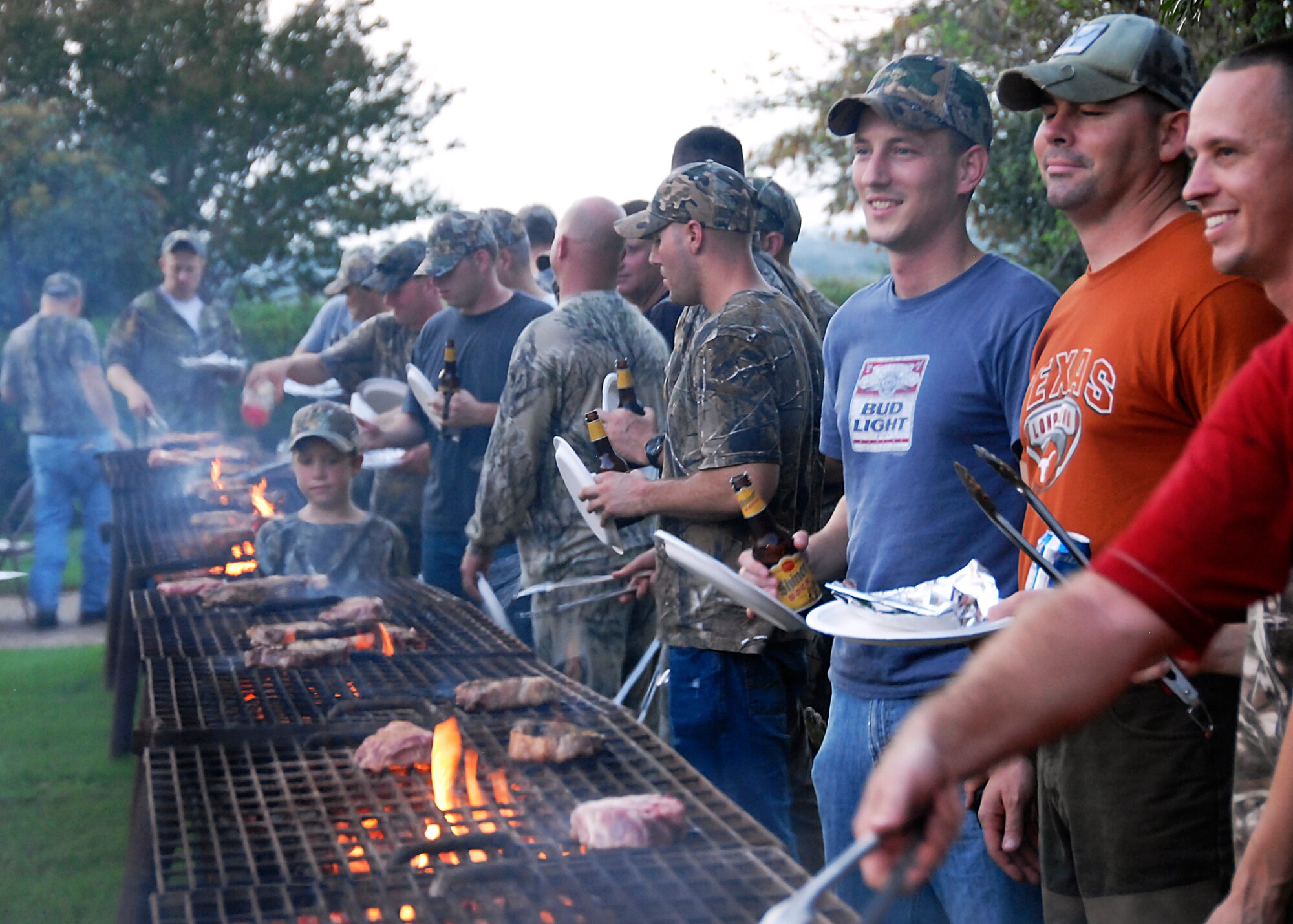 Following a half day of hunting, participants were treated to a home-style steak dinner which was cooked on a 20-foot grill.  More than 160 active-duty servicemembers and 40 community volunteers participated and supported the event.  (U.S. Air Force photo/Harry Tonemah)